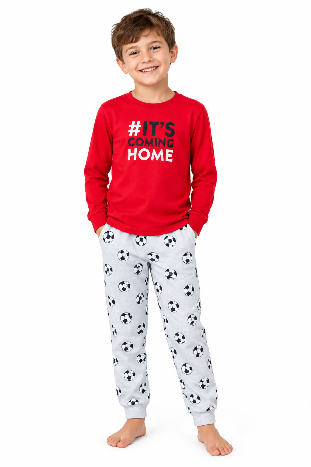 Boy wearing football pyjama set