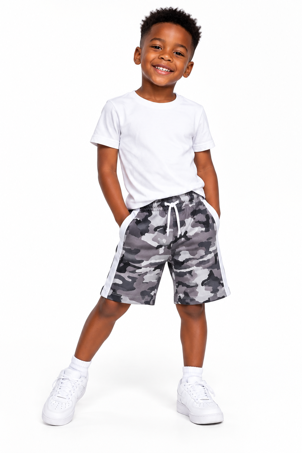 Boys beige camo shorts on model of colour