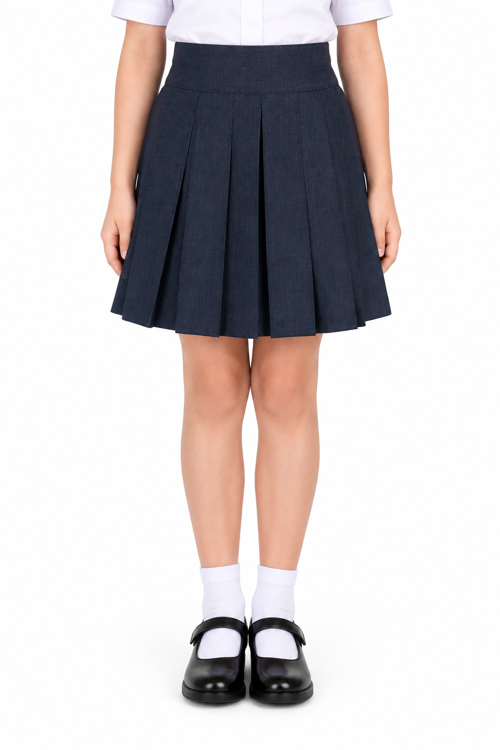 Girl wearing navy pleated school skirt with white shirt and black shoes, waist to feet