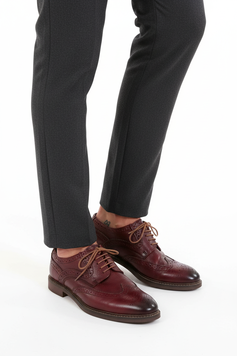 Model wearing burgundy brogues calf down