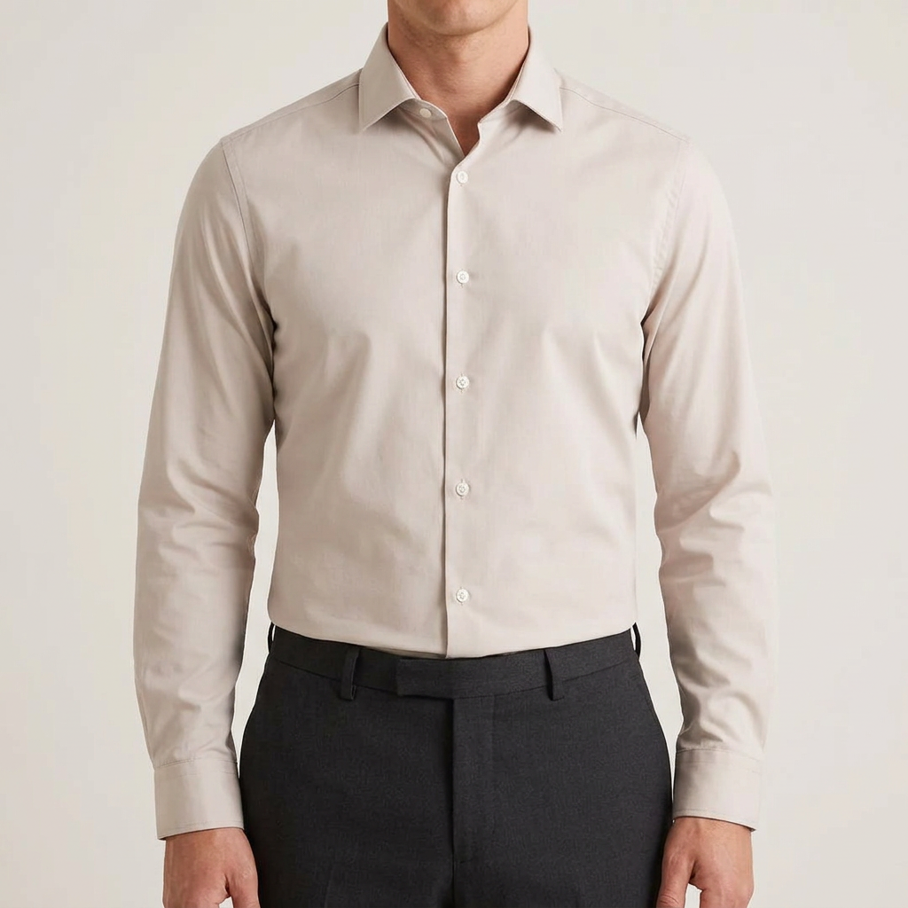 Model wearing the beige shirt tucked in with all buttons closed, cropped neck to waist