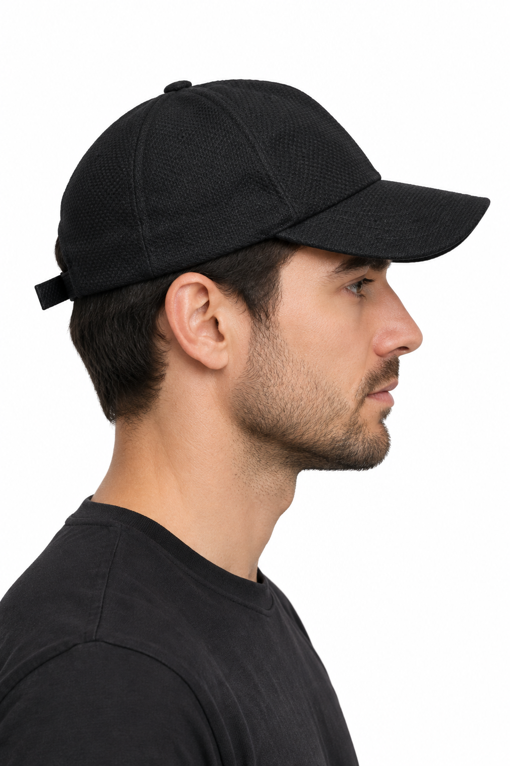 Model wearing the black cap from the side