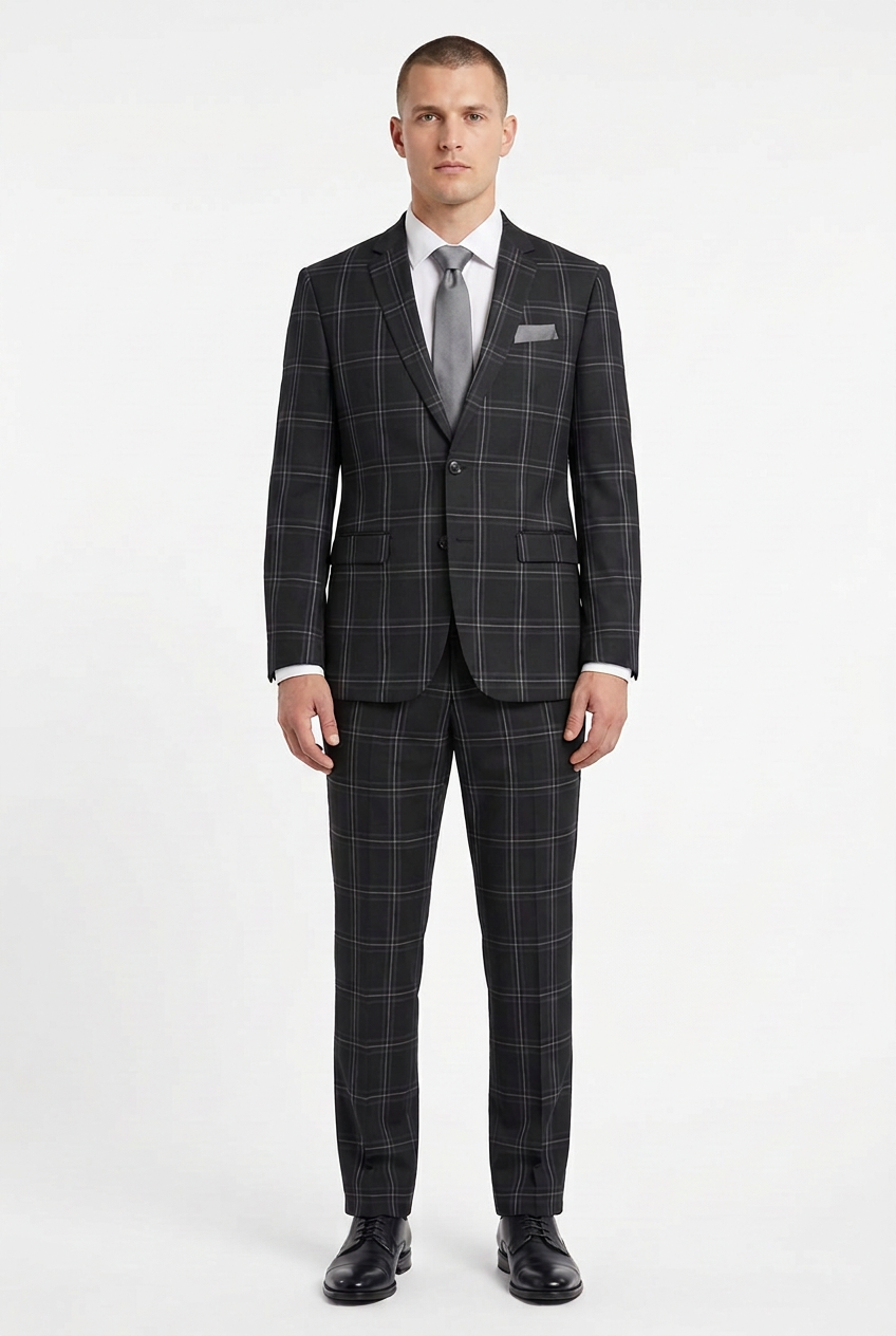 Model wearing the check suit with a grey tie and matching grey pocket square
