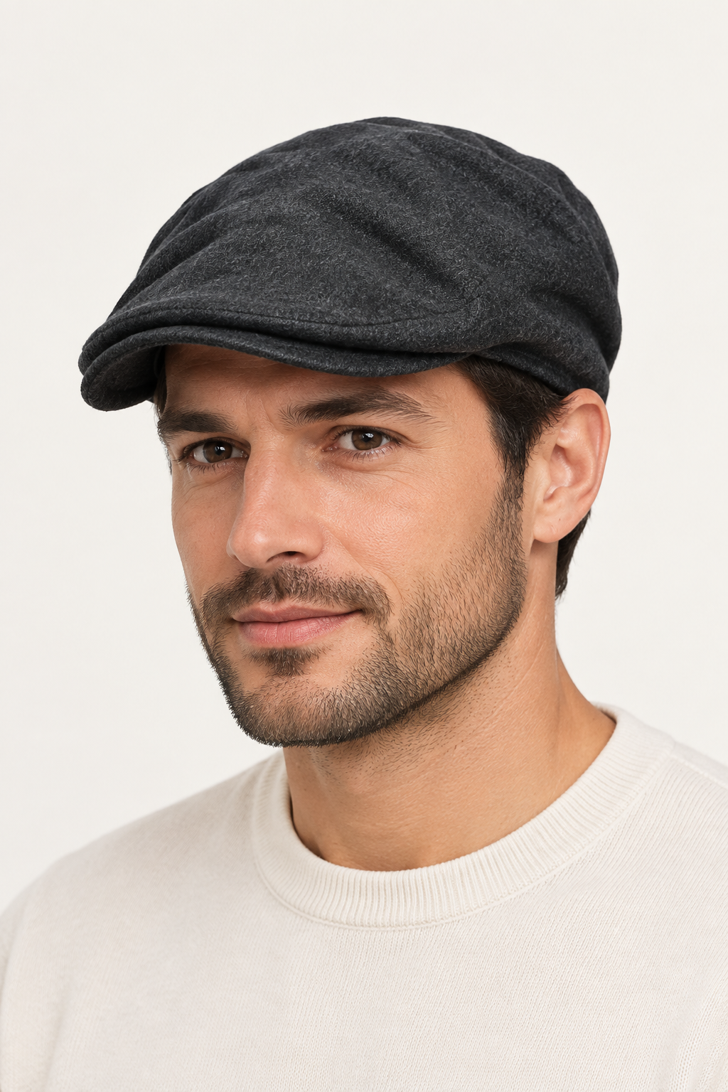 Model wearing the grey flat hat