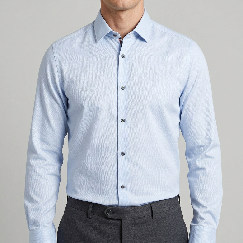 Model wearing the pale blue shirt tucked in with all buttons fastened, cropped neck to waist