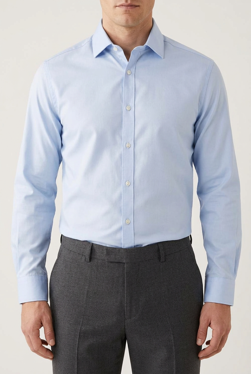 Model wearing the shirt tucked in and buttoned to the collar, cropped neck to waist